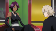 Urahara seated with Yoruichi.