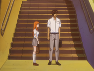 Orihime and Sado watch as Ichigo runs off.