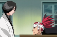 Renji slides across the table to Unohana.