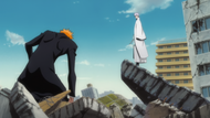 Gin watches as Ichigo kneels in exhaustion.