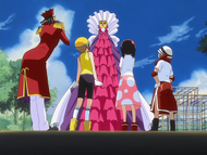 Ururu and the others put Kon in a large dress.