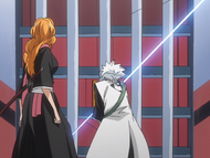 Hitsugaya destroys the door with a slash of his Zanpakutō.