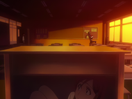 Orihime hides under the desk in the classroom.