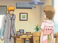 Yuzu tells Ichigo Karin Kurosaki is sick.