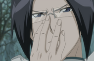 Uryū pushes up his glasses.