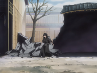 Rukia emerges from the rubble.