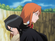 Rukia gives Orihime advice while training.