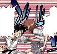 Tatsuki punches Chizuru in the gut for her perverted antics.