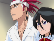 Rukia listens as Renji explains the change in Soul Society's plans.