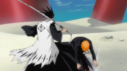 Kenpachi kicks Ichigo away.