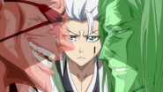 Hitsugaya contemplating on the battle, as Zaraki fights against Inaba