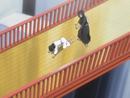 Rukia collapses under the weight of Byakuya's Reiatsu.