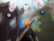 Ichigo is confronted by three large Hollows.