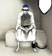 Mayuri sits in his cell in the Nest of Maggots.