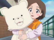 Miyuki holds her plushie, currently inhabited by Kon.