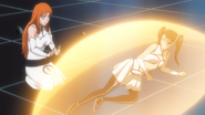 Orihime heals Loly after Yammy's assault.