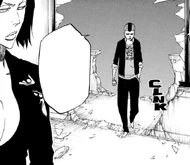 Jackie looks on as Moe Shishigawara enters the mansion.