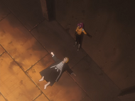 Yoruichi flips Ichigo on his back.