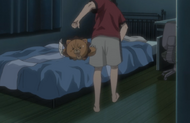 Ichigo knocks Kon away as he prepares to go to sleep.