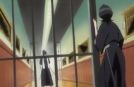 Rukia finds Byakuya standing in a ruined hallway.