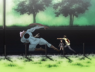 Yasutora Sado punches Shrieker, who lets go of Rukia.