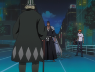 Kon listens as Isshin and Urahara discuss the situation.