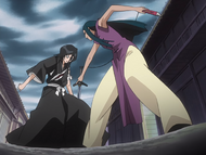 Yoshi stabs her sword through Rukia's leg.