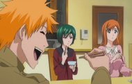 Orihime eating dinner with Kon and Nozomi.