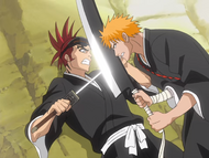 Ichigo forces Renji up against the wall.