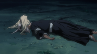 Hiyori lies on the ground seriously wounded.