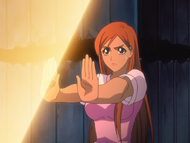 Orihime blocks Yoshi's attack with Santen Kesshun.