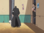 Kenpachi, Ikkaku, and Yumichika peer out at a distressed Iba.