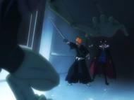 Ichigo's blade gets stuck in the wall.