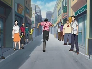 Sado runs down the street to lure Bulbous G away.