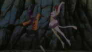 Haineko attempts to hit Yoruichi with a two-handed punch.