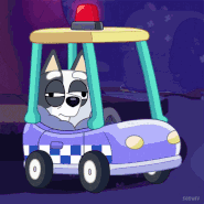Muffin struggling to stay awake in a cop car