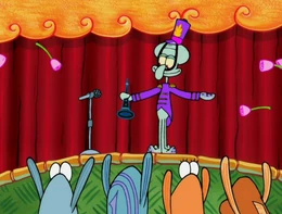 Calamardo siendo felicitado por los peces durante su actuación.