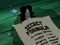 La Fórmula Secreta de la Cangreburger con letras aleatorias.