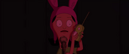 Louise calling Teddy on her Kuchi Kopi walkie-talkie.