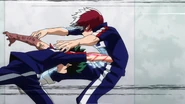 Izuku lands a punch on Shoto.