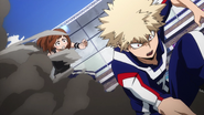 Ochaco distracts Katsuki with her jacket and sneaks behind him.