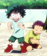 Little Izuku defending another child from Katsuki.