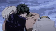 Mezo carries Izuku on his back.