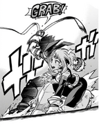 Izuku protects Ochaco from Hitoshi's "Capturing Weapon".