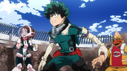 Izuku watches the projectiles fly.