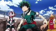 Izuku watches the projectiles fly.