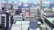 Izuku and All Might atop a building.