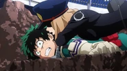 Camie pins down Izuku.