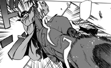 Number 6 deflects Knucklduster's shot.