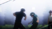Tenya punches Izuku.
